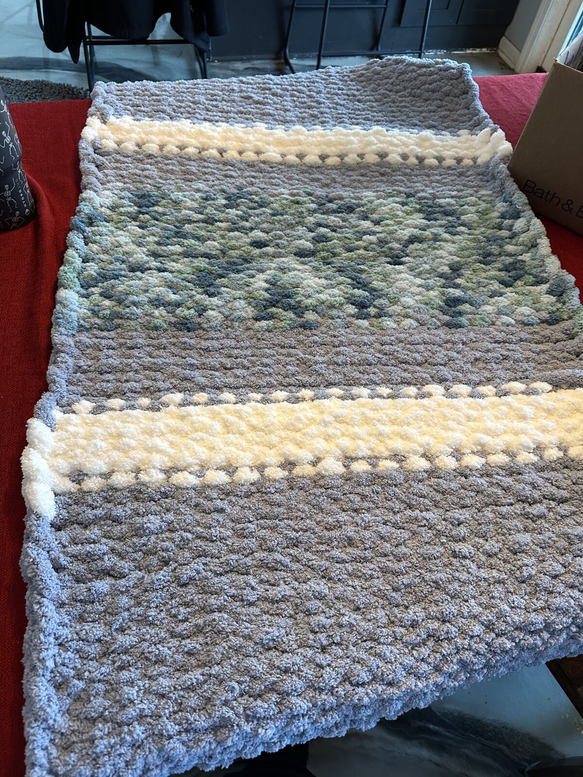 Gray, sage, and cream chunky knit blanket