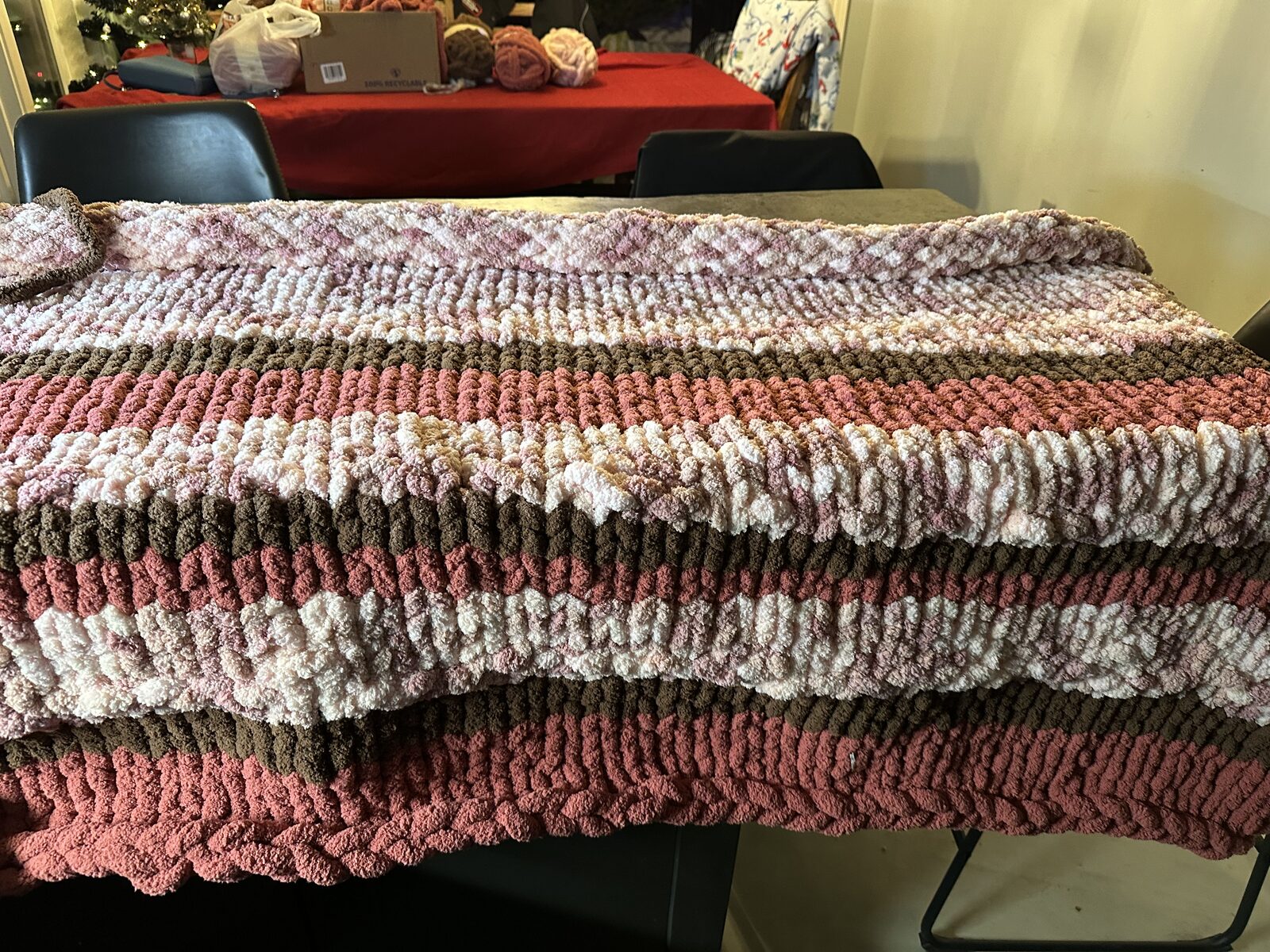 Mauve, rose, and cream striped chunky knit throw
