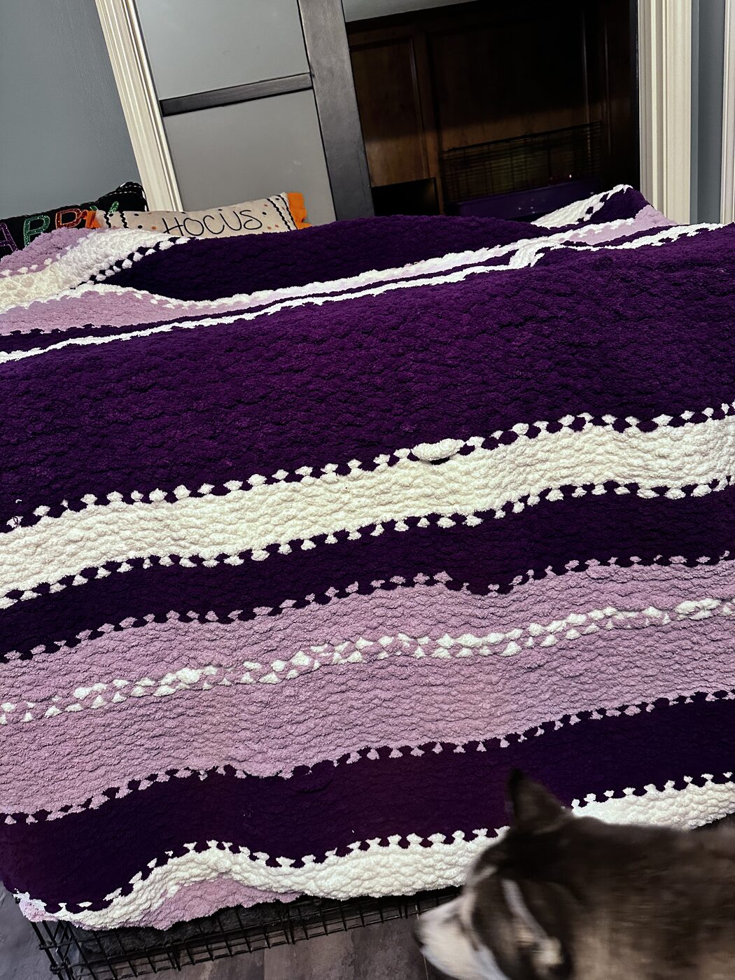 Purple, lavender, and cream striped chunky knit throw