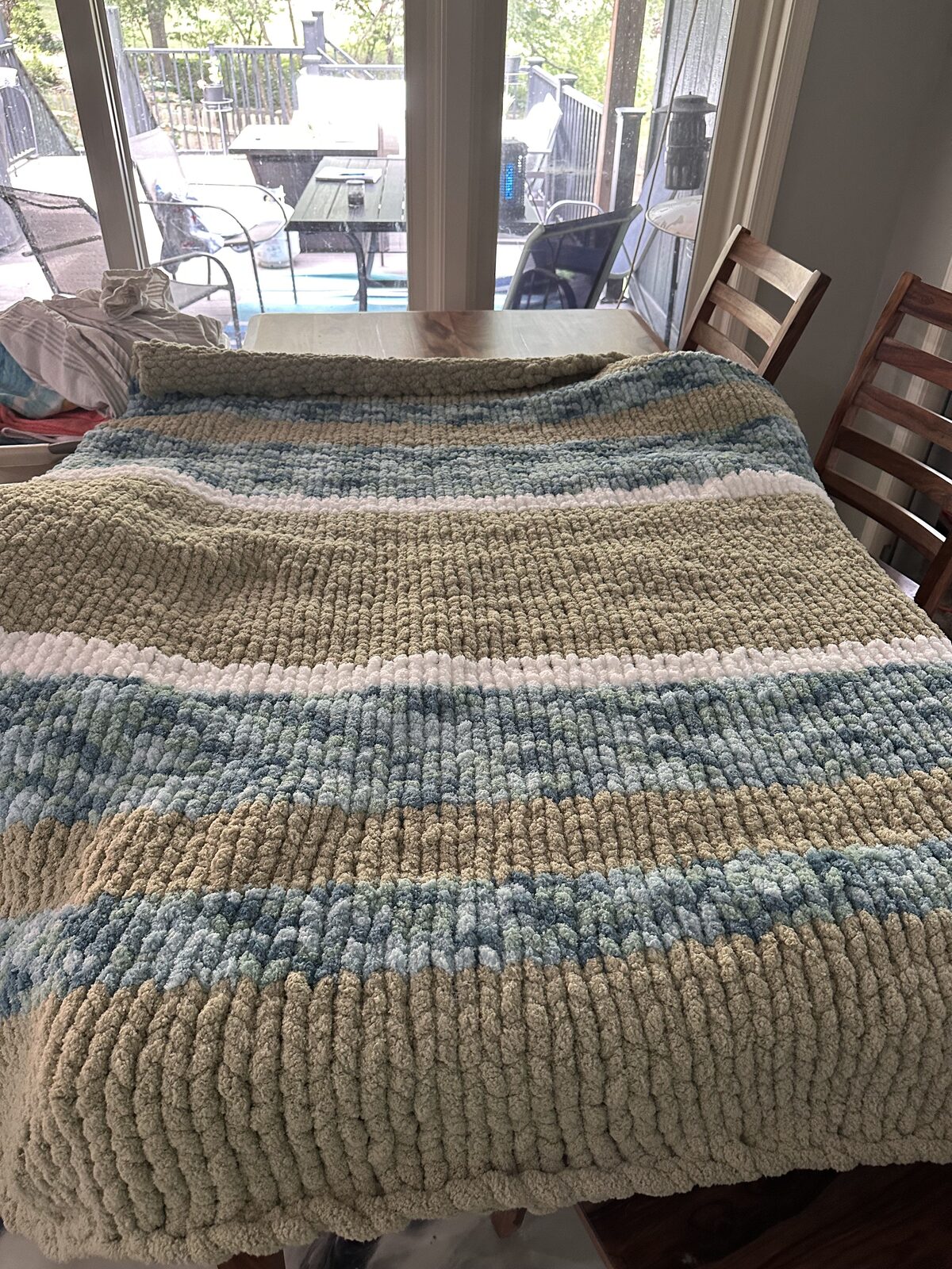 Sage, blue, and cream striped chunky knit blanket